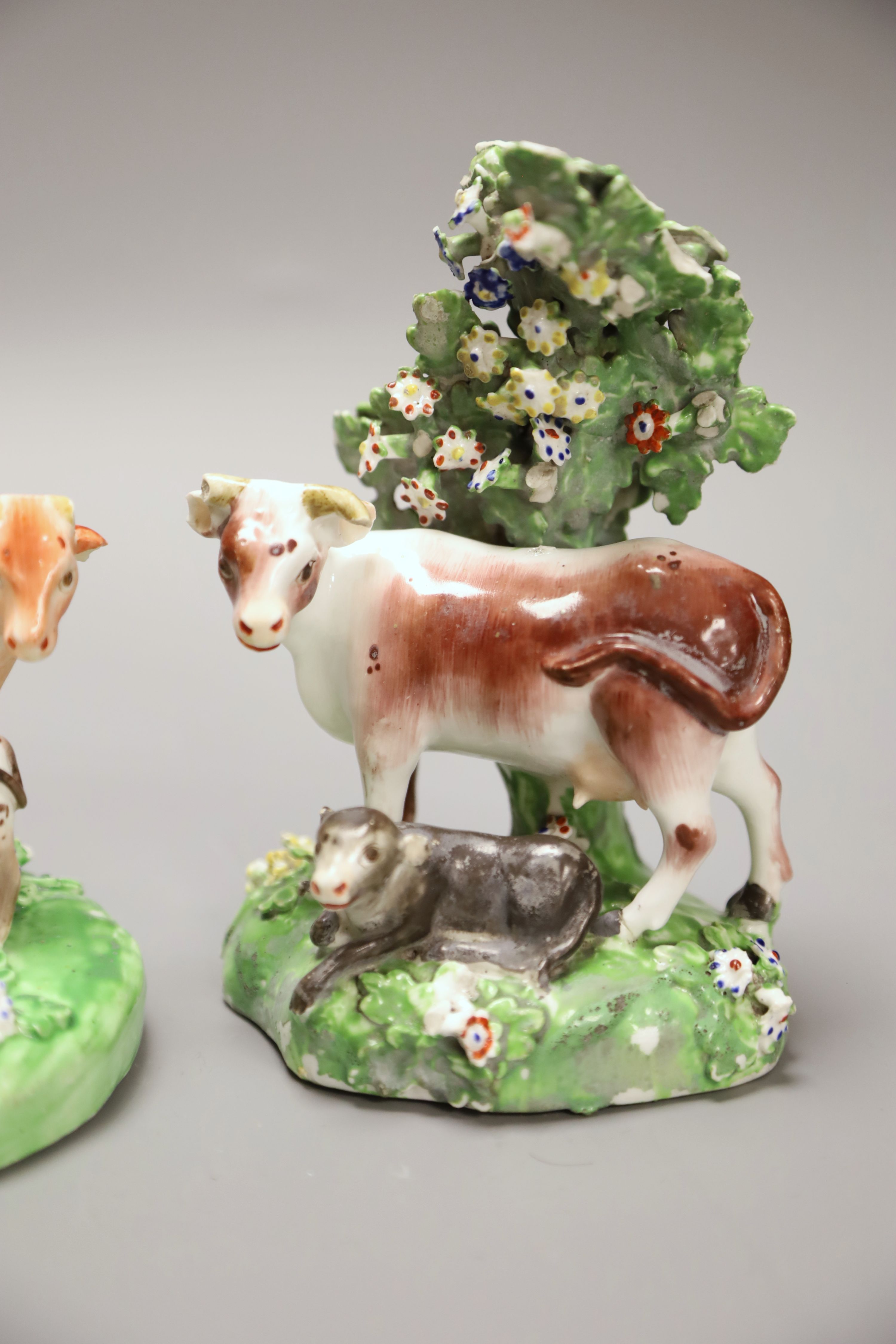 A 19th century Derby pair of cow and calf groups, height 15cm